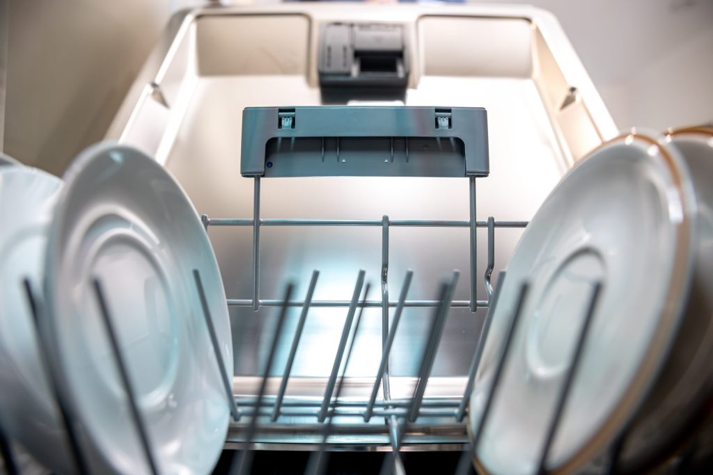 close-up-clean-plates-inside-dishwasher-scaled